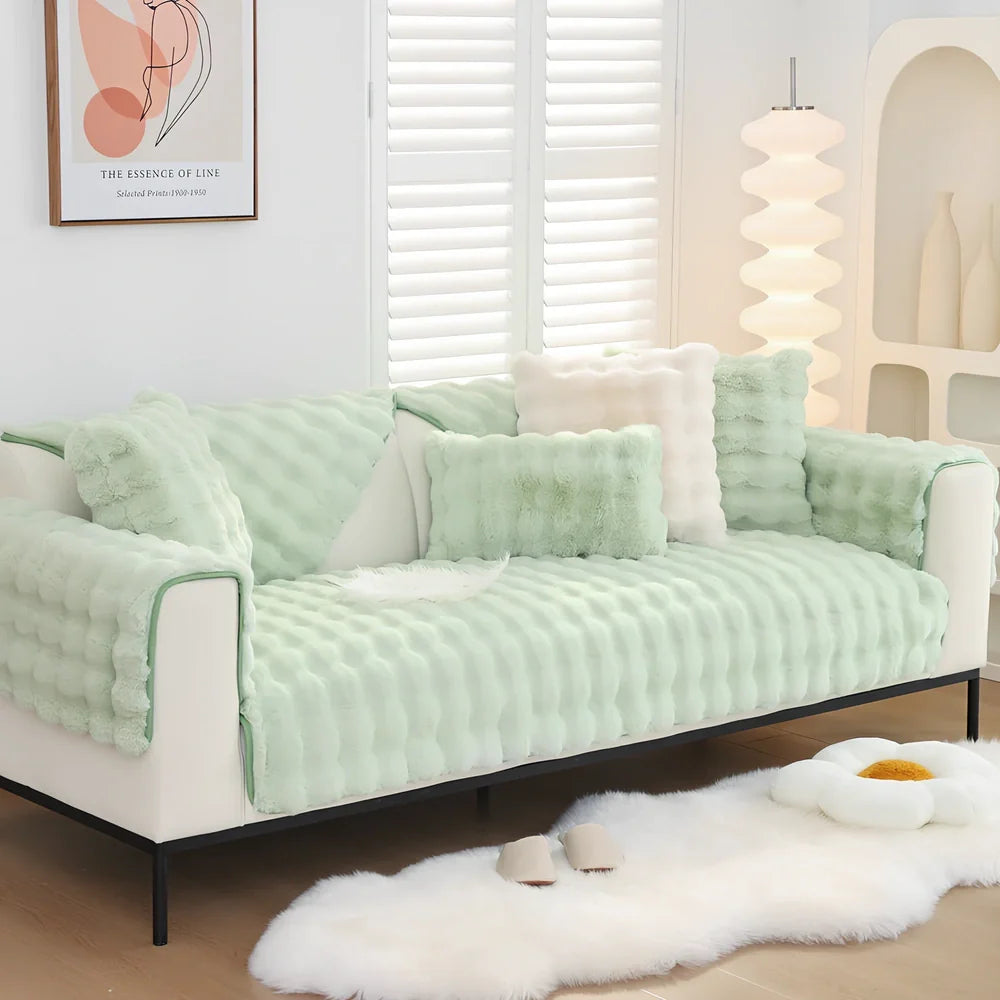 Square flannelette sofa cushion in light blue colour measuring 110x160cm on grey fabric sofa