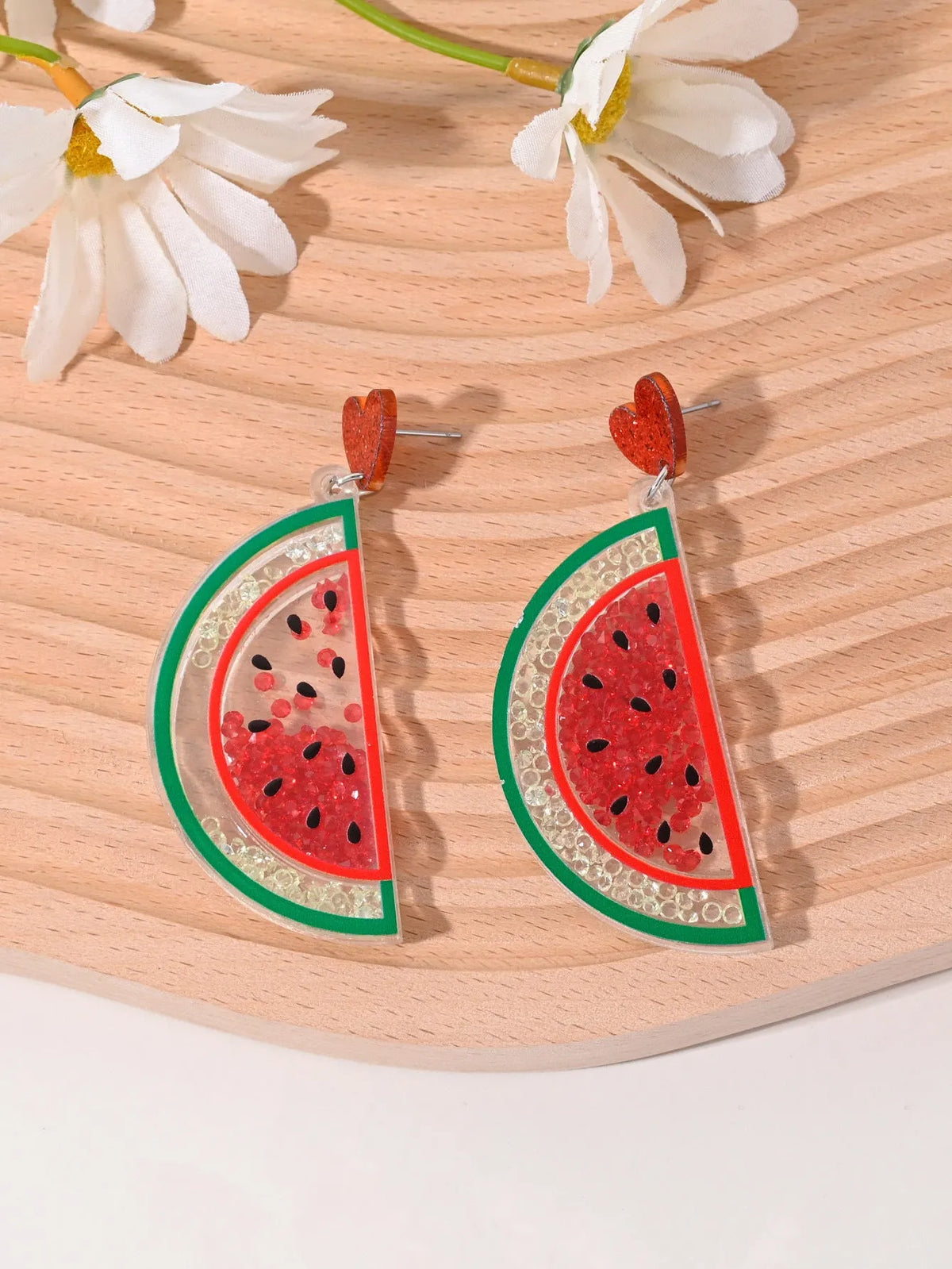 Colourful acrylic earrings with fruit and dessert designs including cherry, strawberry, watermelon, pineapple, coconut, cake and ice cream motifs