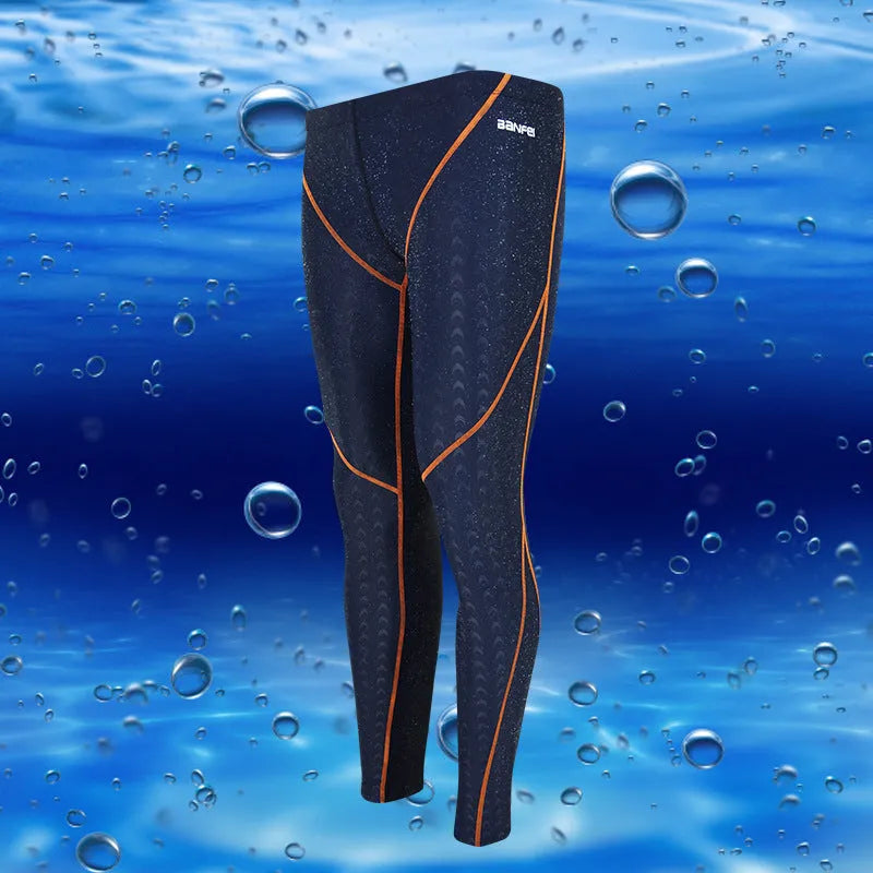 Men's black and grey cropped nylon swimming trunks with mesh lining, laid flat.