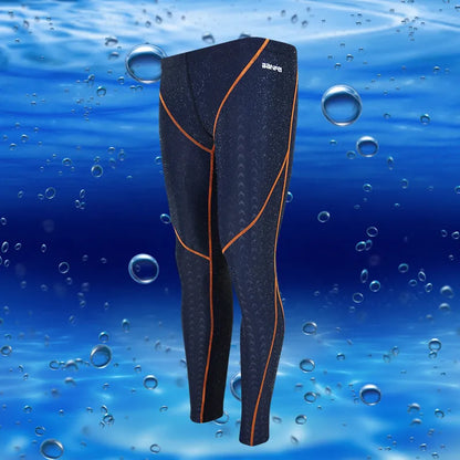 Men's black and grey cropped nylon swimming trunks with mesh lining, laid flat.