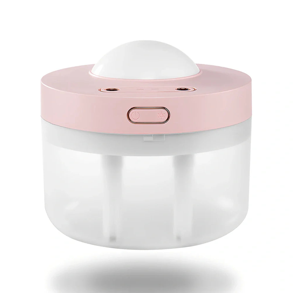 White portable humidifier with rotating projection light showing blue illumination and dual spray mist output