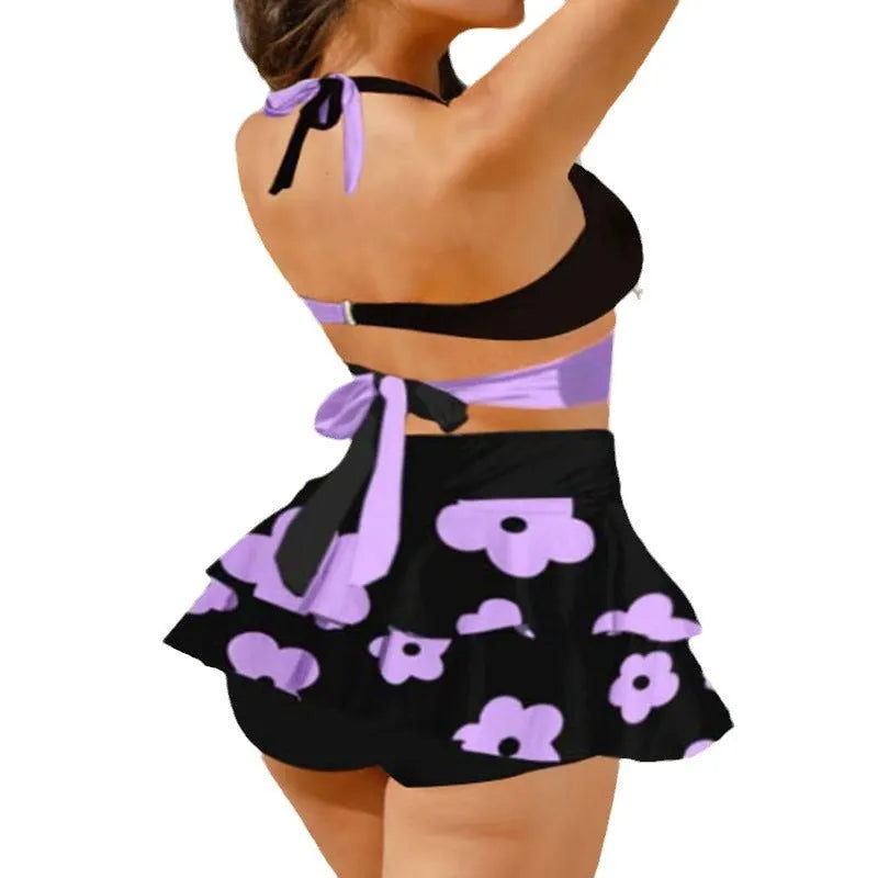 Purple and black women's high waist bikini set with lace-up top and separate swim skirt.