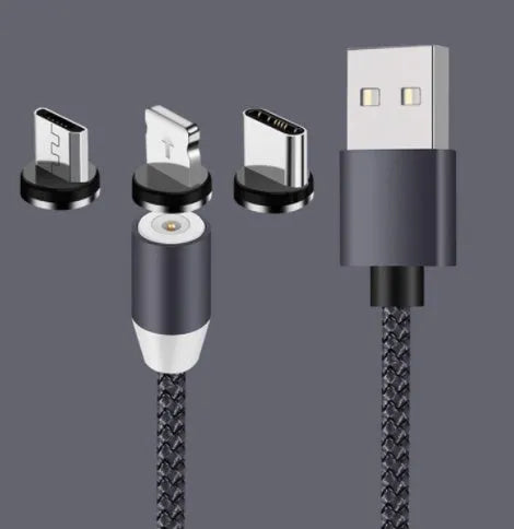 Black spherical magnetic charging cable with rotating head next to iPhone and Android phones
