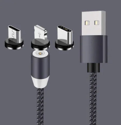 Black spherical magnetic charging cable with rotating head next to iPhone and Android phones