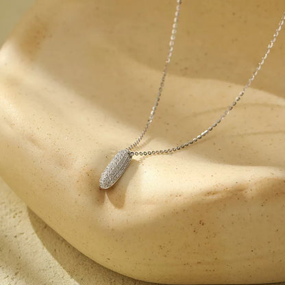 Stainless steel initial pendant necklace with zircon accents, personalized with your choice of letter.