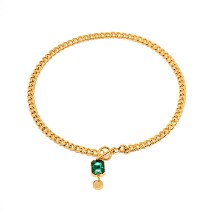 Gold geometric pendant necklace with emerald zircon stone on a titanium steel Cuban link chain