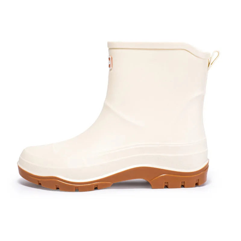 Women's low-cut white waterproof plastic shoes with a non-slip rubber sole on a plain background.