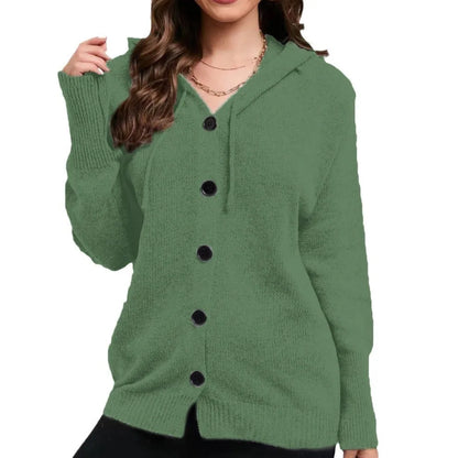 A woman wearing a loose, thick, hooded cotton cardigan in a solid colour.