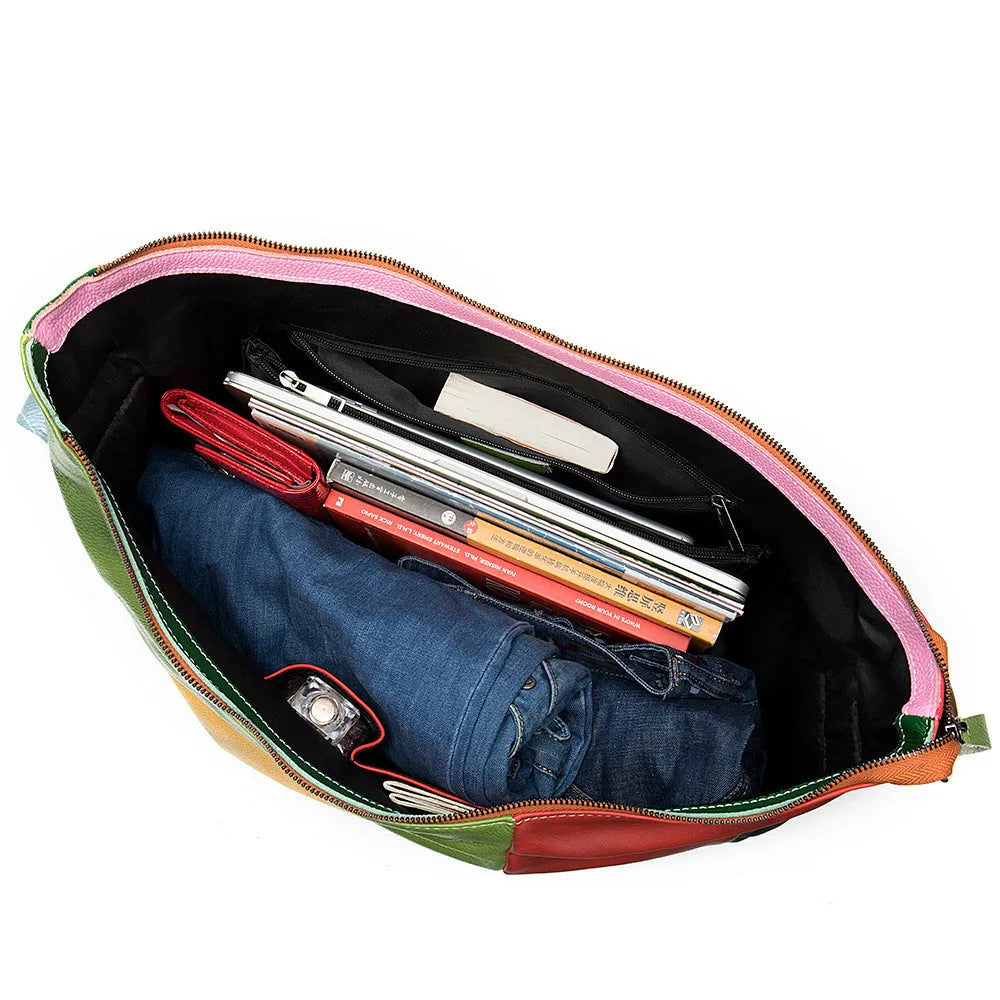 Cowhide leather crossbody bag showing its size, suitable for carrying a 15-inch laptop and A4 documents.