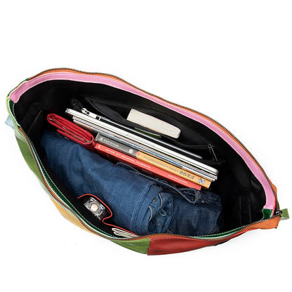 Cowhide leather crossbody bag showing its size, suitable for carrying a 15-inch laptop and A4 documents.
