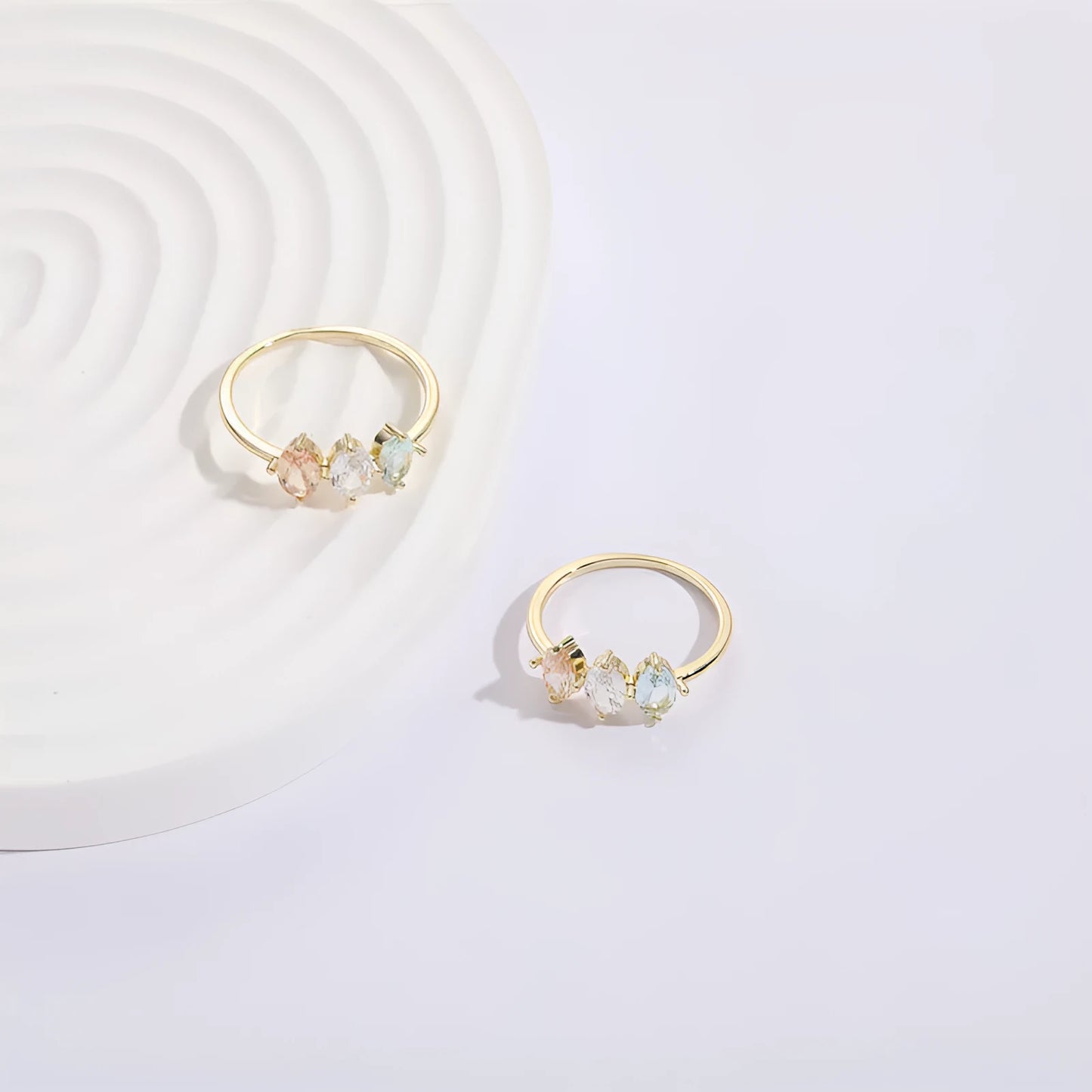 Geometric women's copper ring with triangle design, tricolour zircon stones, and birthstone in electroplated gold finish