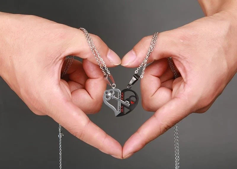 Elegant stainless steel love pendant necklace set for couples, perfect Valentine's gift.