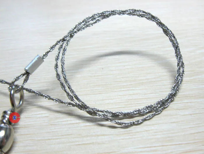 Outdoor survival wire saw with stainless steel blade and pull ring handles for camping and bushcraft