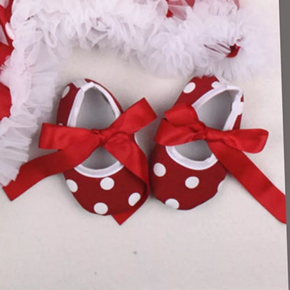 Four-piece Christmas newborn clothing set in natural cotton, including romper, headband, sock, and shoes