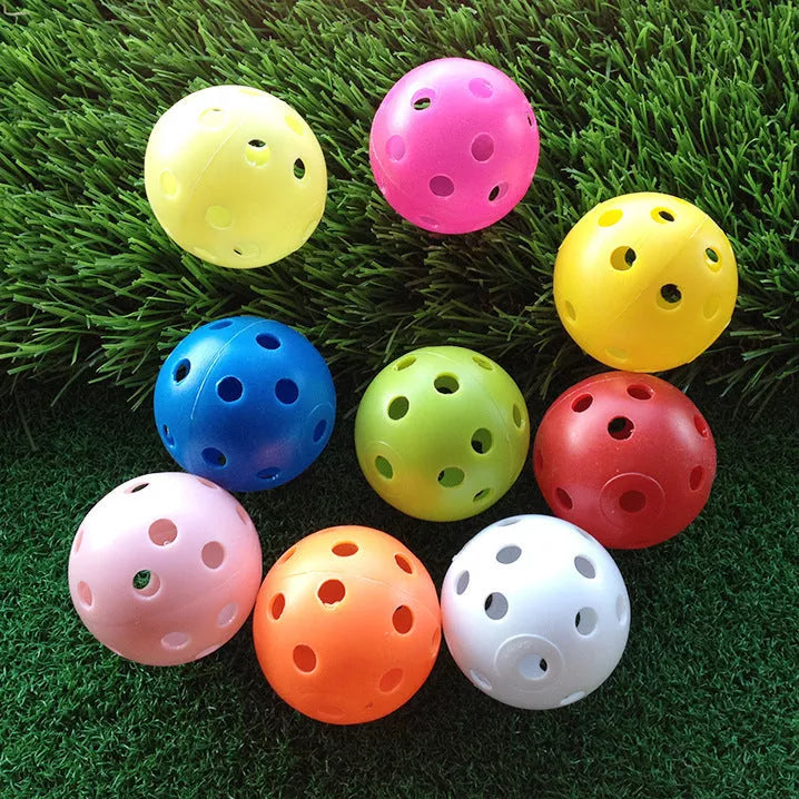 Hollow plastic golf practice balls in various colors for indoor use