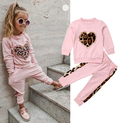 Pink cotton print sweatshirt and matching pants two-piece set with Asian sizing chart showing measurements