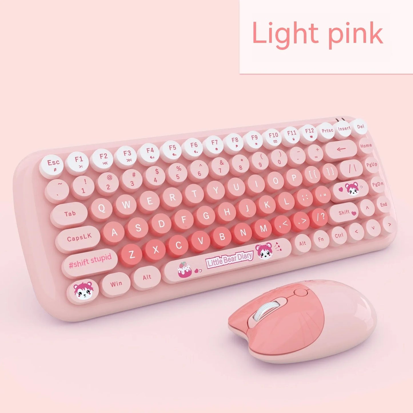Pink mini wireless keyboard and mouse set with cute cartoon design on desk