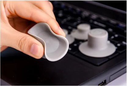 Gray plastic laptop cooling pad stand with two large and two small pads for temperature reduction