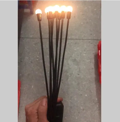 Solar-powered ground plug lawn light with automatic dusk-to-dawn operation and multiple head configurations