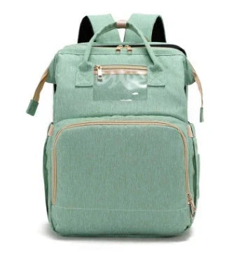 Versatile baby changing backpack with USB charging port and folding portable bed