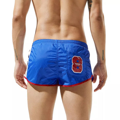 Men's lightweight polyester shorts for summer sports in various colors