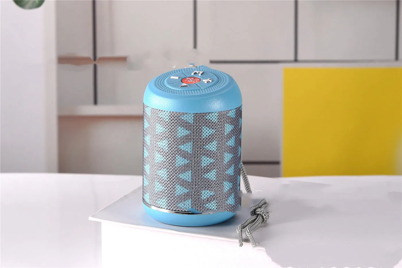 Portable outdoor Bluetooth subwoofer speaker in multiple colours showing button controls.
