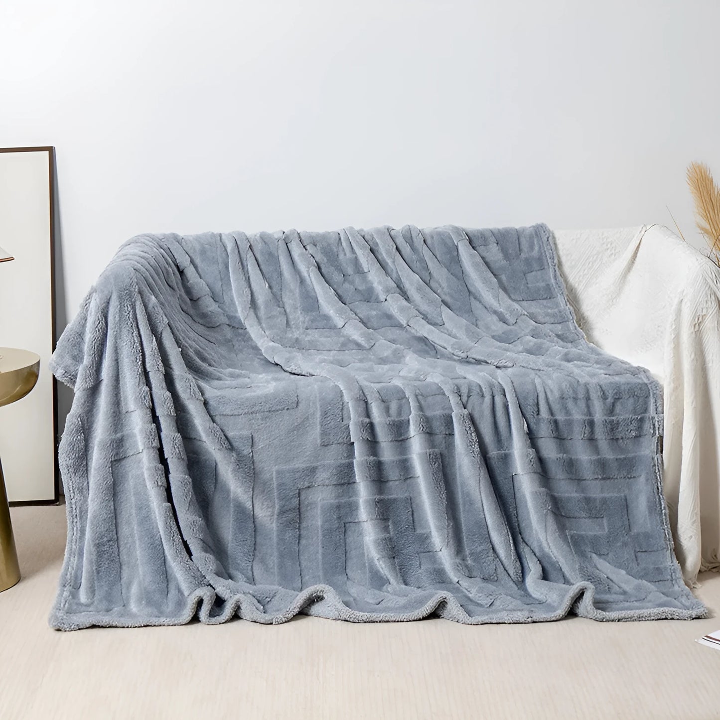 Thick square coral fleece blanket in a modern style, shown in one of five colours including lake blue or khaki.