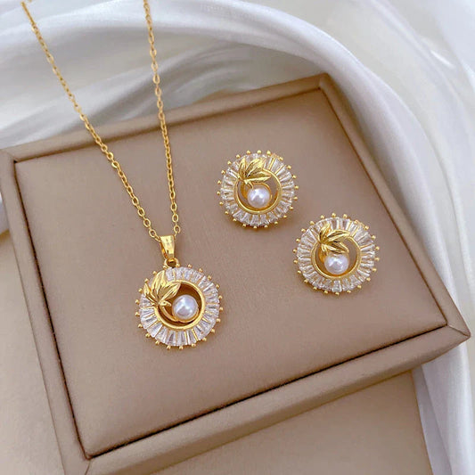 Geometric crystal jewelry set including necklace, earrings, and ring with square-shaped design and sparkling crystals