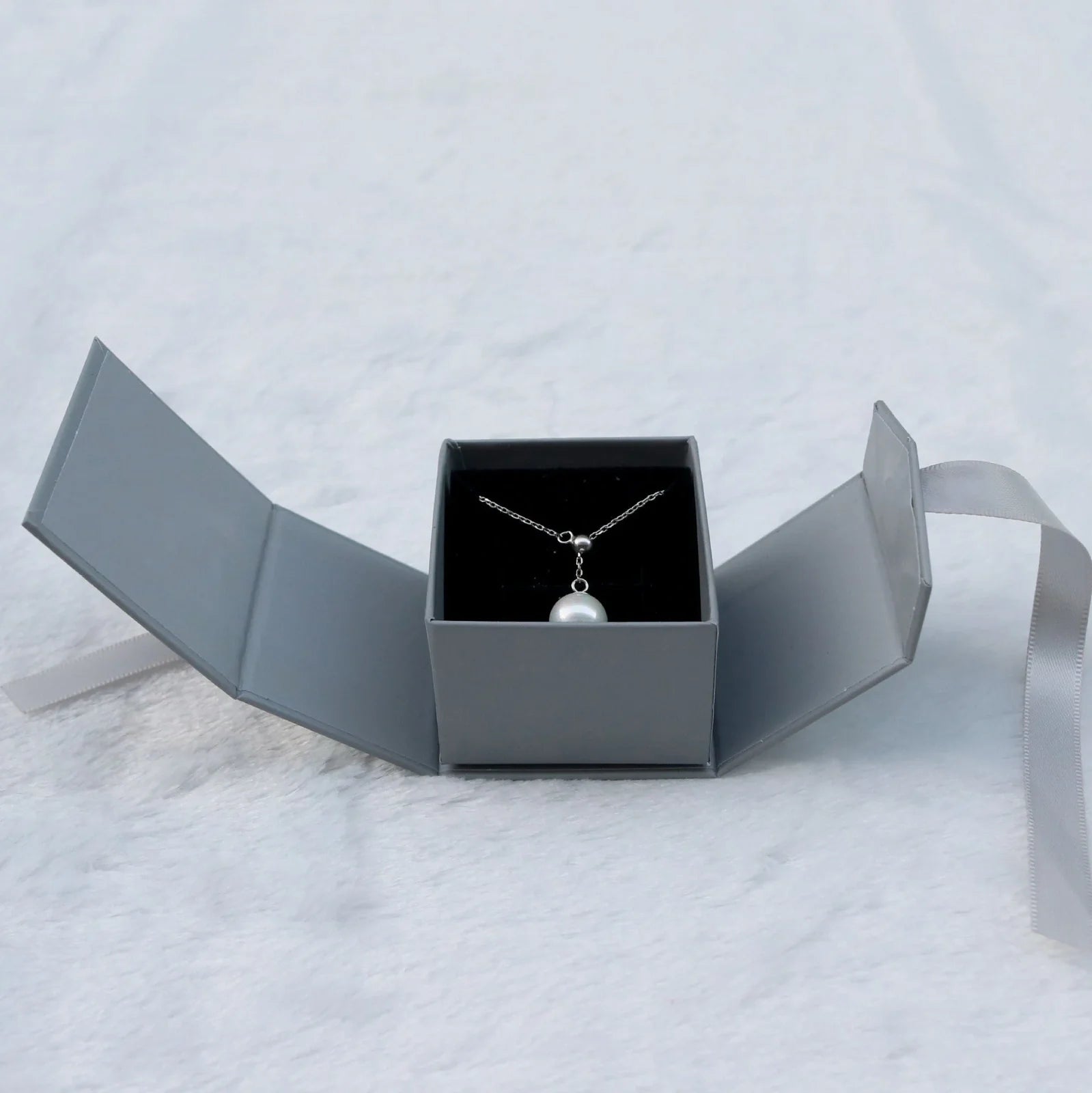 Square grey jewellery gift box with ribbon bow measuring 5x5cm for ring and earring storage