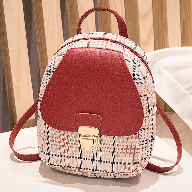 Diagonal one-shoulder phone bag in PU leather, shown in red, worn crossbody.