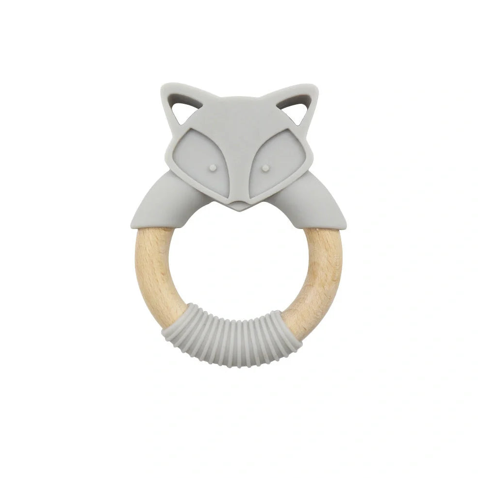 Wooden fox teether with orange silicone ring measuring 80mm high
