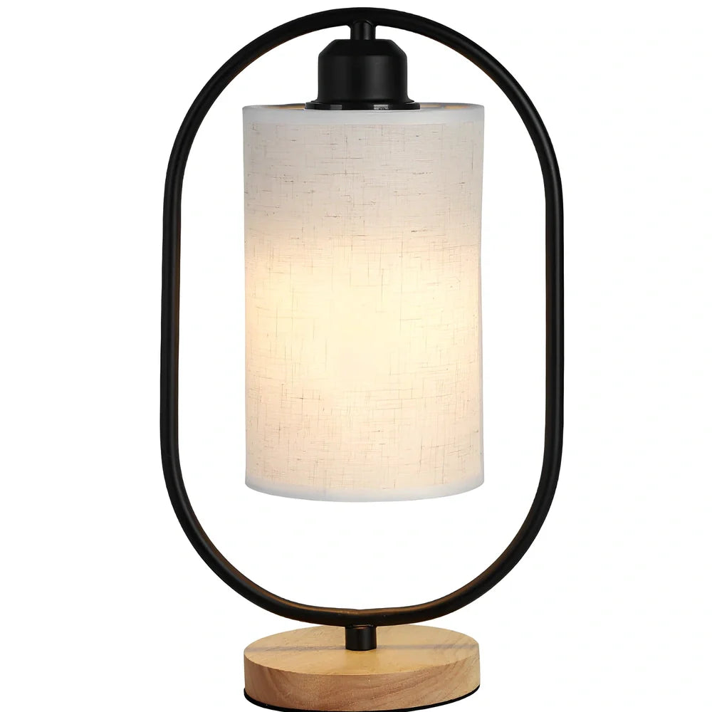 Black metal bedside lamp with dimming button and 5W LED warm light on wooden table