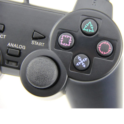 PS2 wired vibration game controller in metallic finish with USB connection cable