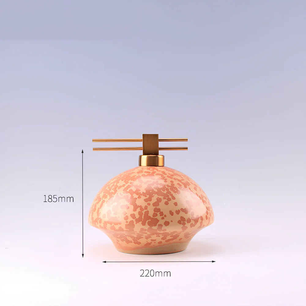 Handmade ceramic ornaments in graduated sizes with emerald green and golden sunlight glazes