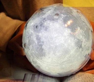 Galaxy Projector Lamp with various celestial projection effects, including moon, constellation, and earth patterns