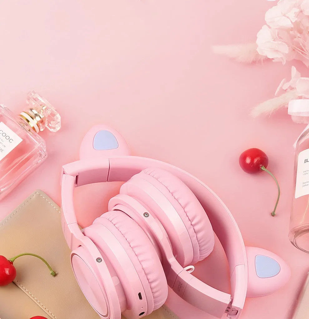 Pink and white wireless Bluetooth headset with 40mm speakers and braided cable