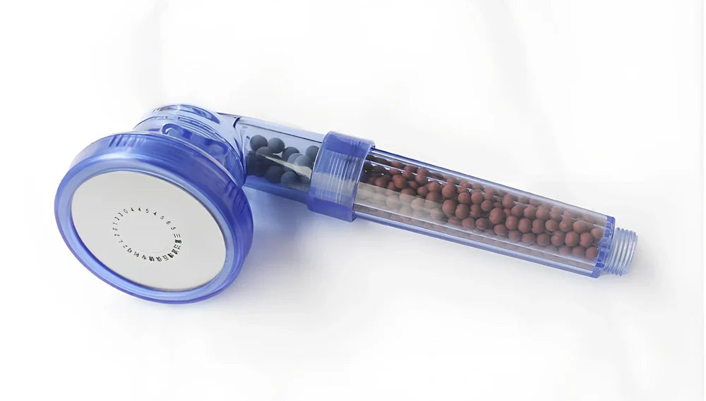 Pressurised shower head with stainless steel panel showing three water mode settings and removable nozzles