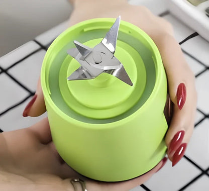 Portable blender with 400ml transparent cup, USB charging port, and 6 stainless steel blades