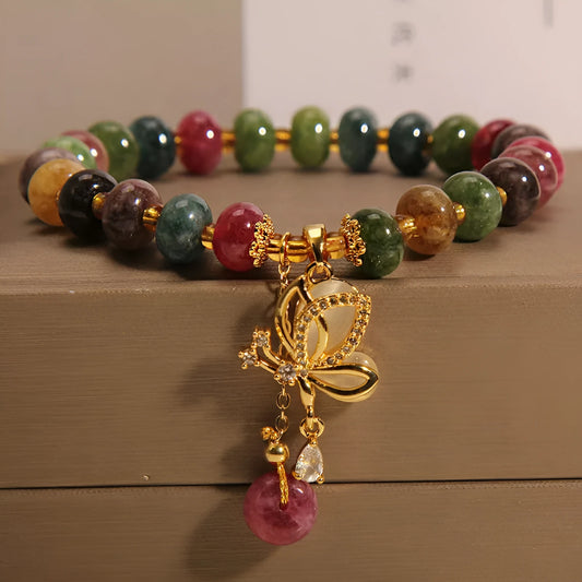 Colourful women's bracelet with butterfly charm, beads, and tourmaline accents on an alloy chain.