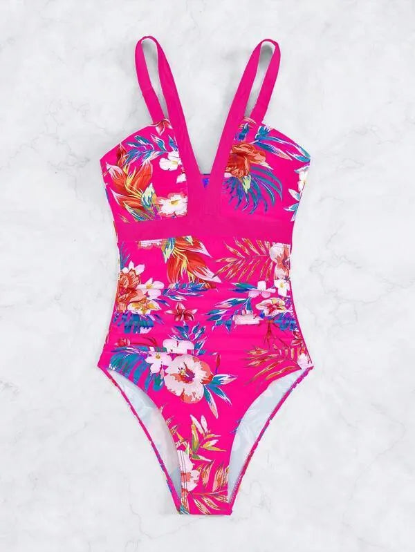 Women's floral pattern backless one-piece swimsuit on a hanger.
