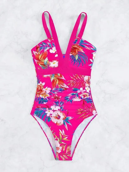 Women's floral pattern backless one-piece swimsuit on a hanger.
