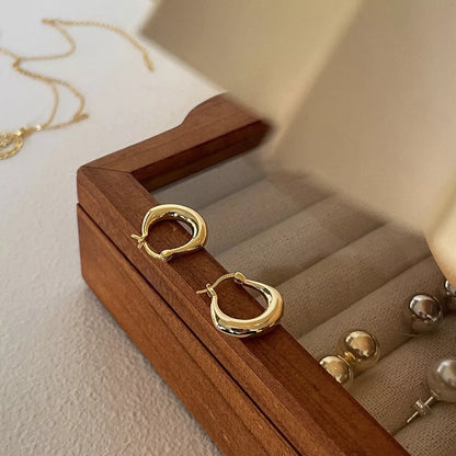 Small Fat Circle Ear Clip Bracelet in white gold and yellow gold colors