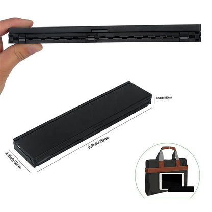 Black folding Bluetooth keyboard for tablets showing compact 5.8-inch size with wrist support extended