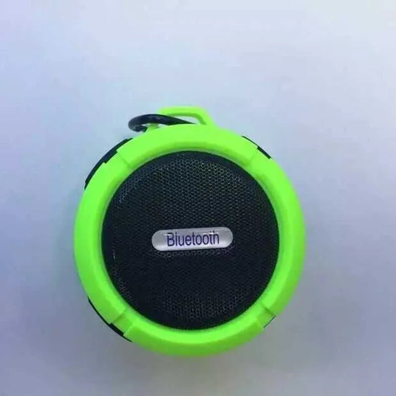 C6 portable waterproof Bluetooth speaker in multiple colours with a mounting clip attached.