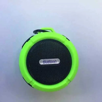 C6 portable waterproof Bluetooth speaker in multiple colours with a mounting clip attached.
