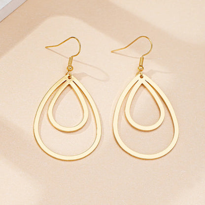 Golden yellow hollow drop earrings made from iron, shown as a single pair for everyday fashion.
