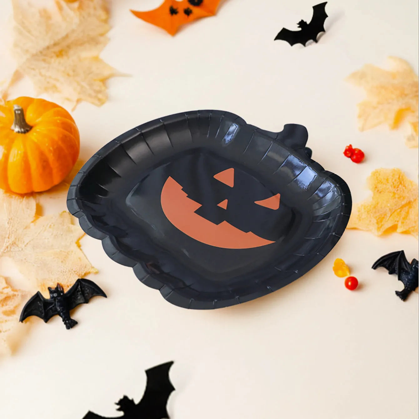 Black pumpkin design disposable paper plates for Halloween, 9-inch diameter