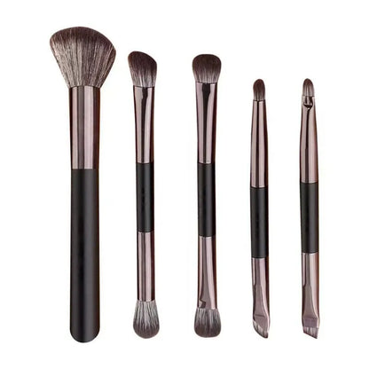 Makeup brush set with mirror compact case showing silver or gold brushes with artificial fibre bristles