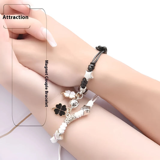 Magnetic suction couple bracelet pair in alloy with an electroplated finish, showing example designs like a crown and love lock.