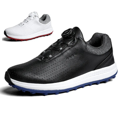 Men's white and black casual golf shoes with perforated upper and low-top design on a grass surface.
